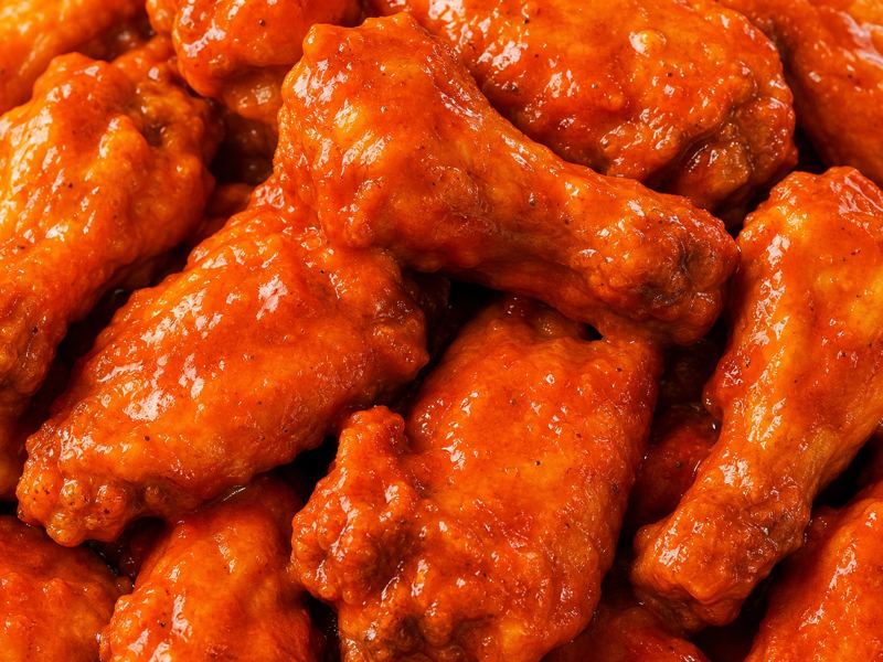 Close-up of sauced chicken wings